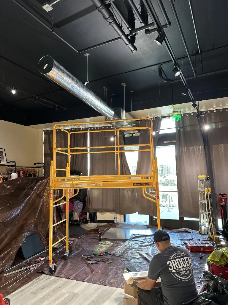3rdGen crew installing commercial spiral duct and airside distribution in an occupied retail build-out.