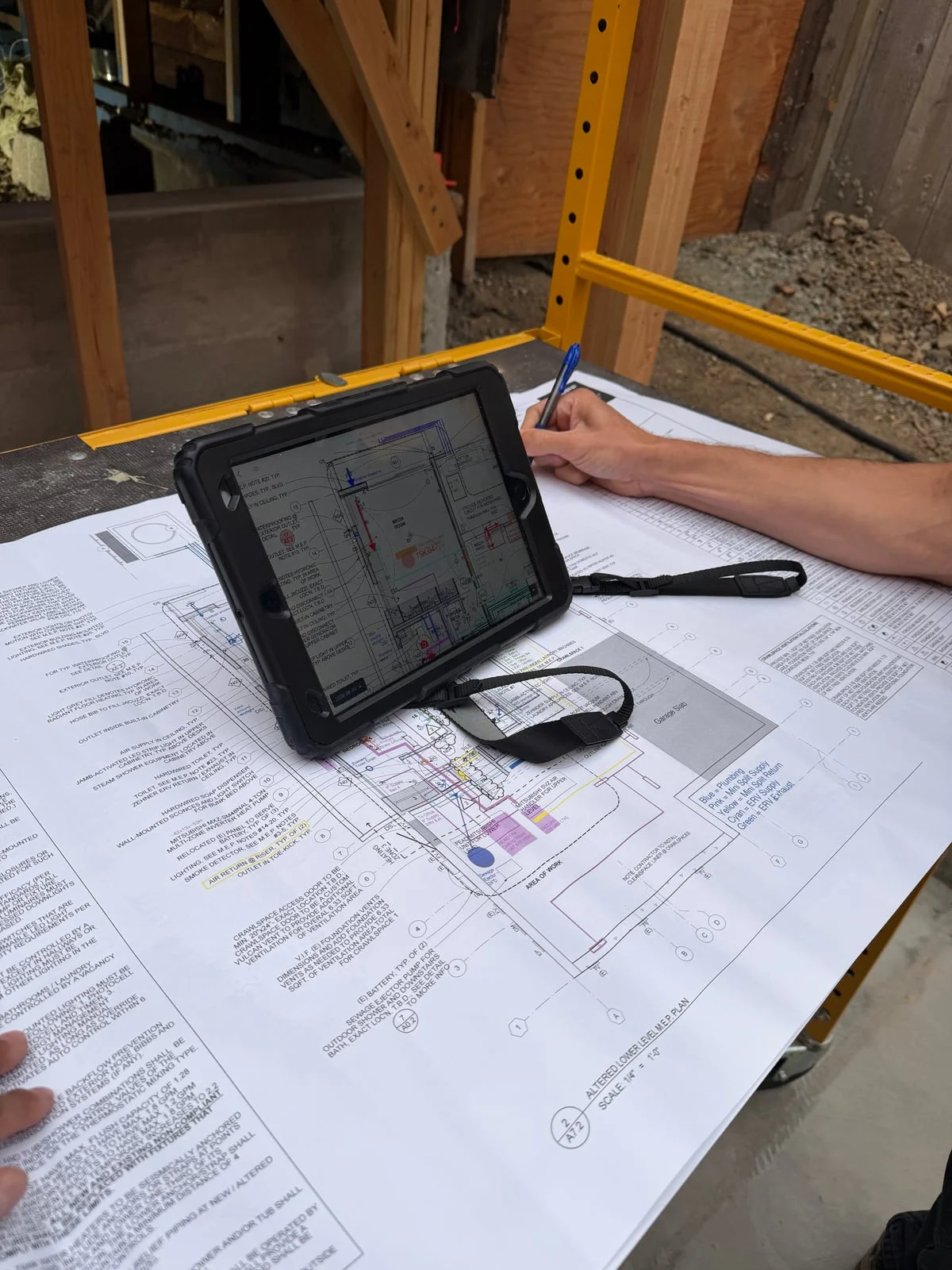 Mechanical plans being coordinated on a residential jobsite